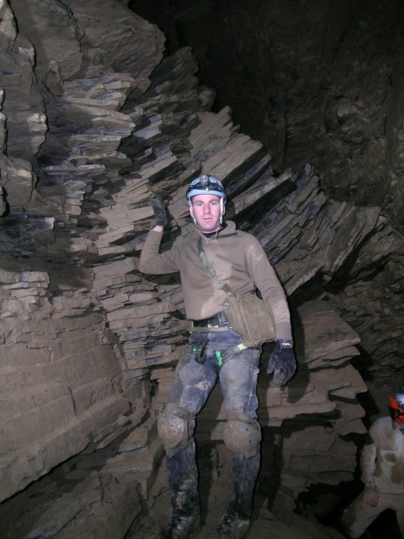Photo of Brad in the Spring Room, Gage Cave.